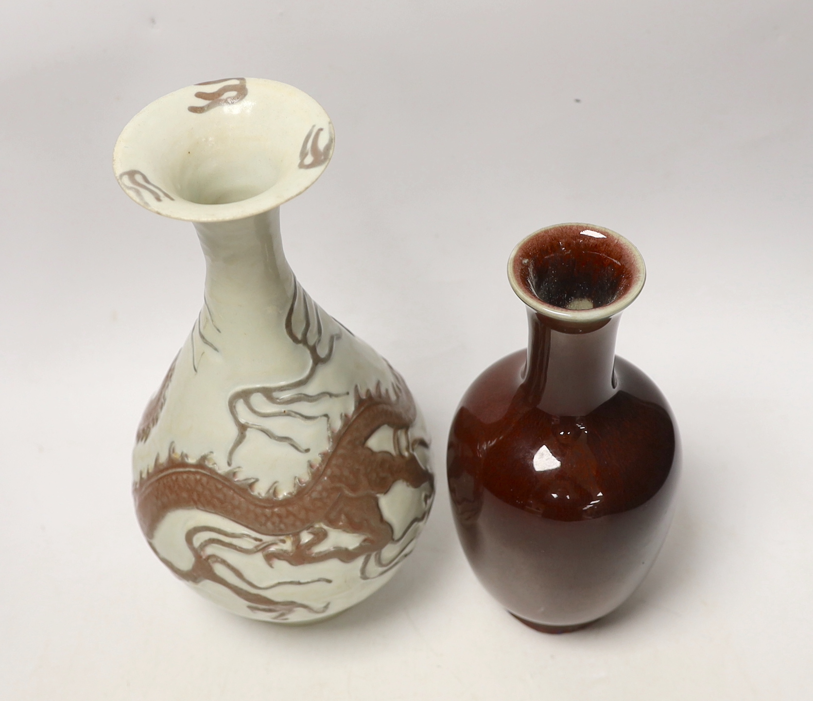 A Chinese sang de boeuf glaze vase and another copper red ‘dragon’ vase, tallest 26cm
